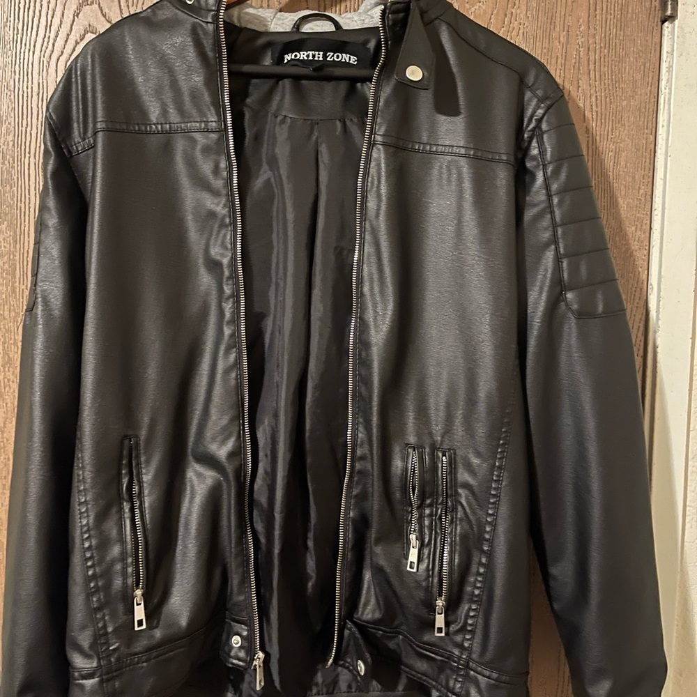 I’m selling a black leather jacket with a gray hoodie, Size (S),